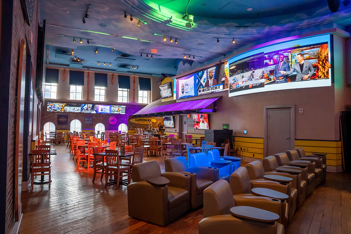 Landshark Sportsbook interior with comfortable lounge chairs and many tvs